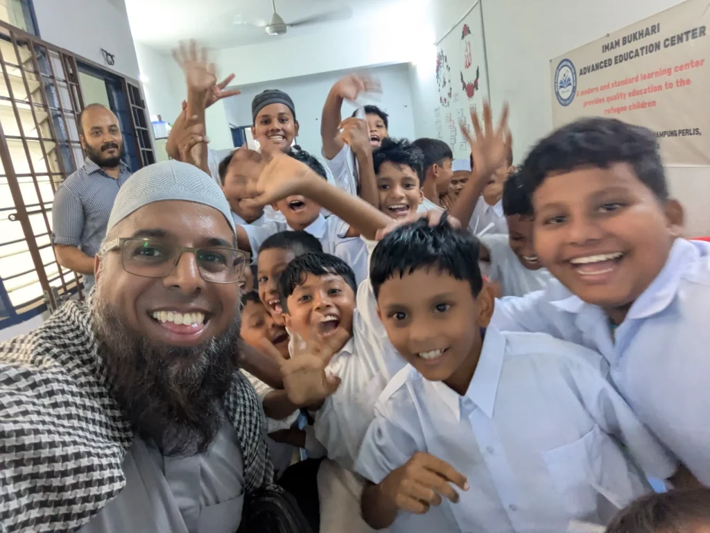 Ishaaq Jasat with children in MAlaysia
